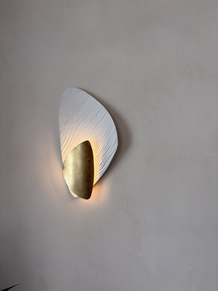 Custom wall sconce in alluvium and gold