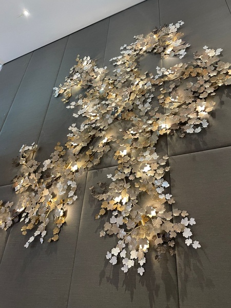 Detail of a wall sculpture in the shape of vine leaves